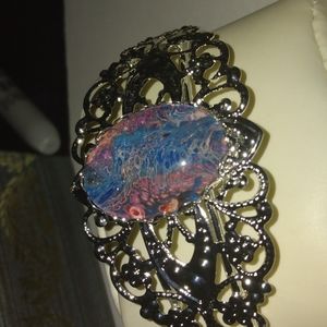 Antique style bracelet with one of a kind center